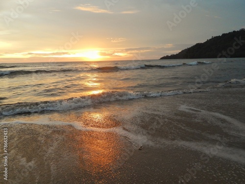 sunset with calm sea waves