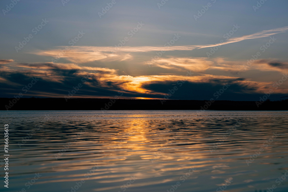 Sunset over the river surface