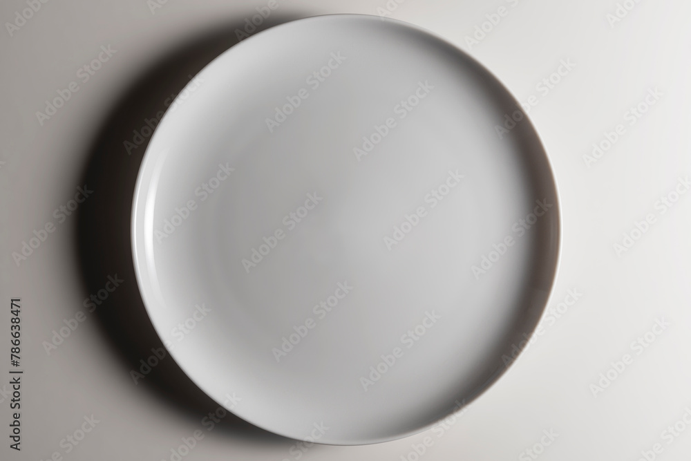 Empty white dinner plate without wing with slightly curved edge with a modern design Empty white dinner plate without wing with slightly curved edge with a modern design