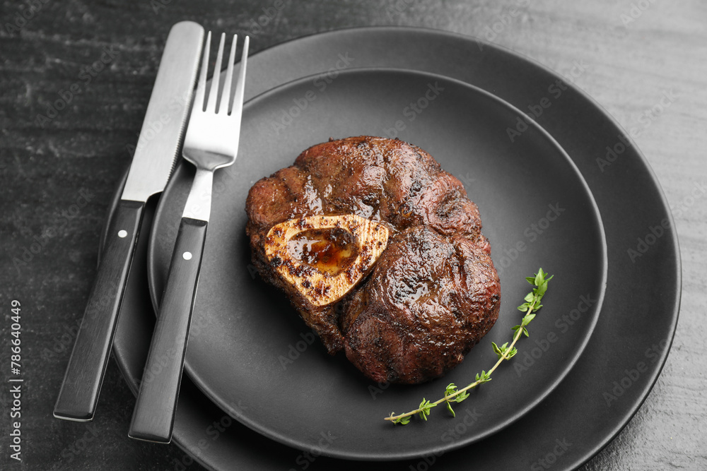 Tasty grilled beef meat served on black table, closeup Tasty grilled beef meat served on black table, closeup