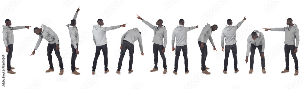 Obraz premium group of same man pointing fingers everywhere on white background