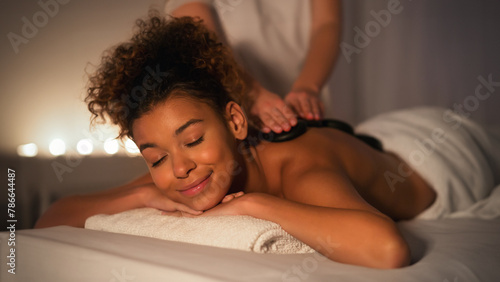 Calming night spa massage experience for a lady photo