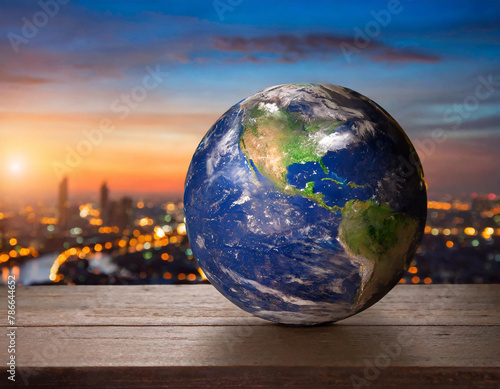The Earth is on the table  with a blue sky and sunset in the background The globe has an elegant dark color tone  with blurred city lights at its edge