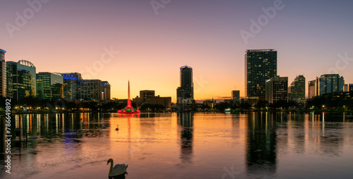 Panoramic view of Orlando city at sunset with fountain in Lake Eola, Orlando, Florida, USA © lucky-photo
