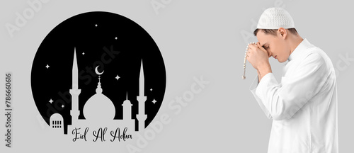 Young Muslim man with prayi...