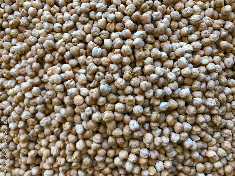 Dry organic chickpeas as background close up. Heap of white chickpeas. Food background. Biological food. Dry organic chickpeas as background close up. Heap of white chickpeas. Food background. Biological food.