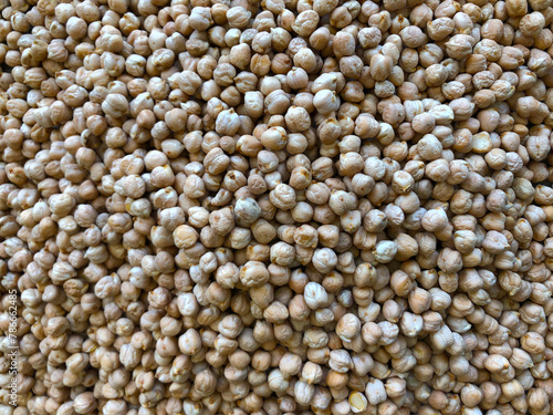 Dry organic chickpeas as background close up. Heap of white chickpeas. Food background. Biological food.