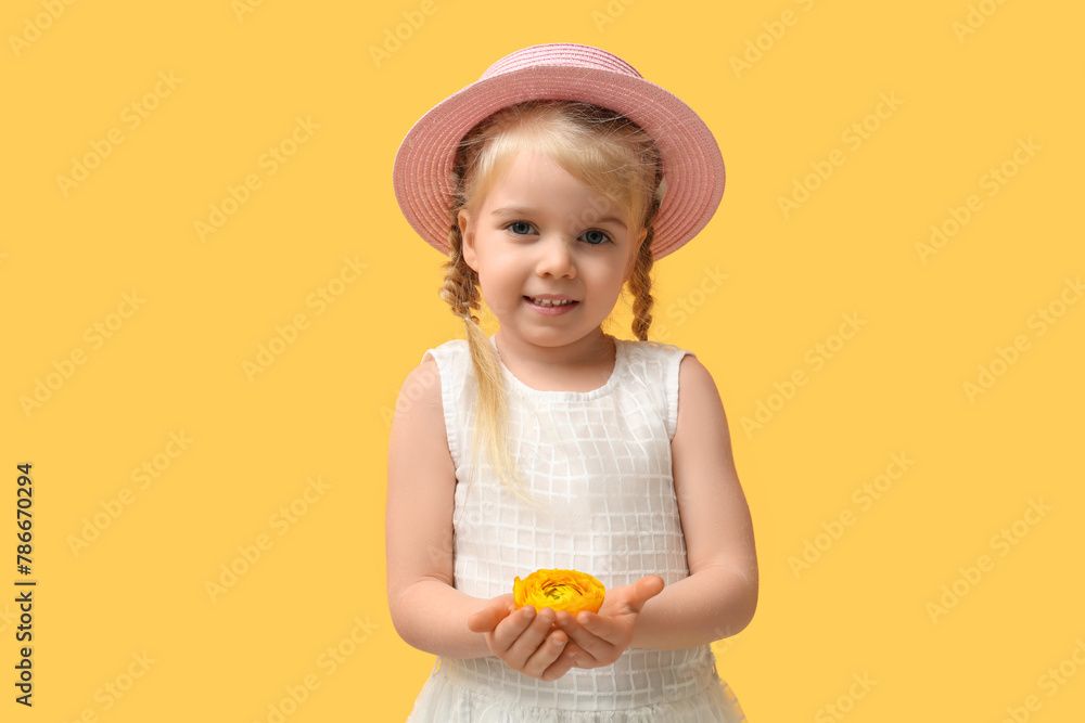 Cute little girl with beautiful yellow ranunculus flower on color background Cute little girl with beautiful yellow ranunculus flower on color background
