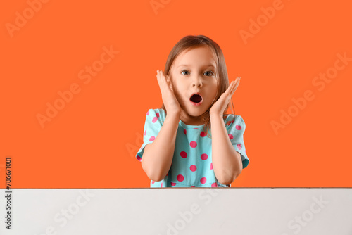 Shocked little girl with bl...