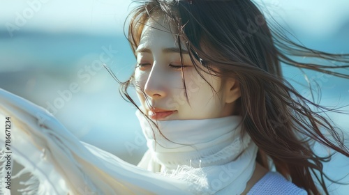 Joyful South Korean Woman Embracing the Breeze photo