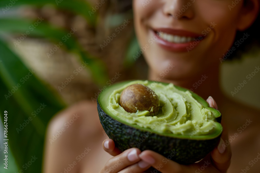 Close-up of a smiling woman applying natural avocado body butter for healthy skin Close-up of a smiling woman applying natural avocado body butter for healthy skin