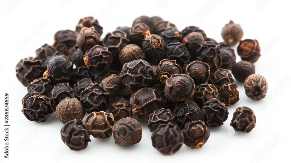 A pile of black pepper seeds on a white surface. Perfect for culinary and cooking concepts A pile of black pepper seeds on a white surface. Perfect for culinary and cooking concepts