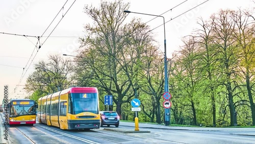 WARSAW, POLAND - APRIL 15 2018: Tram and bus travel for DW629 near Slasko-Dabrowski Bridge in Warsaw, Poland.