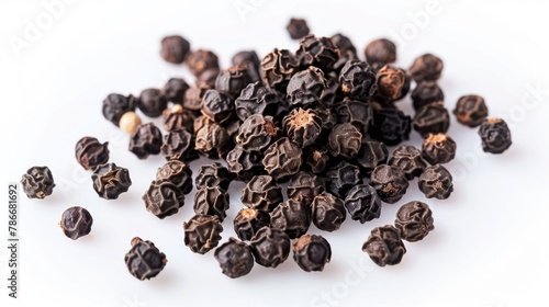 A pile of dried black pepper on a white surface, perfect for culinary or spice themed projects