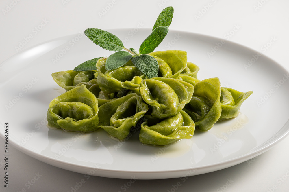 Dinner plate with green ravioli and sage Dinner plate with green ravioli and sage