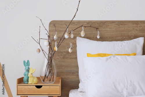 Vase with tree branches and...