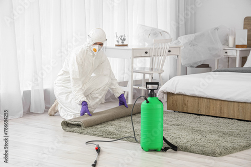 Male worker in hazmat suit ...