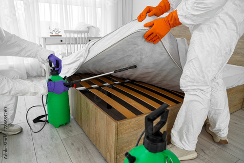 Male workers disinfecting b...