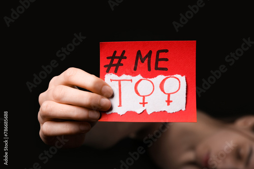 Woman holding paper with ha...