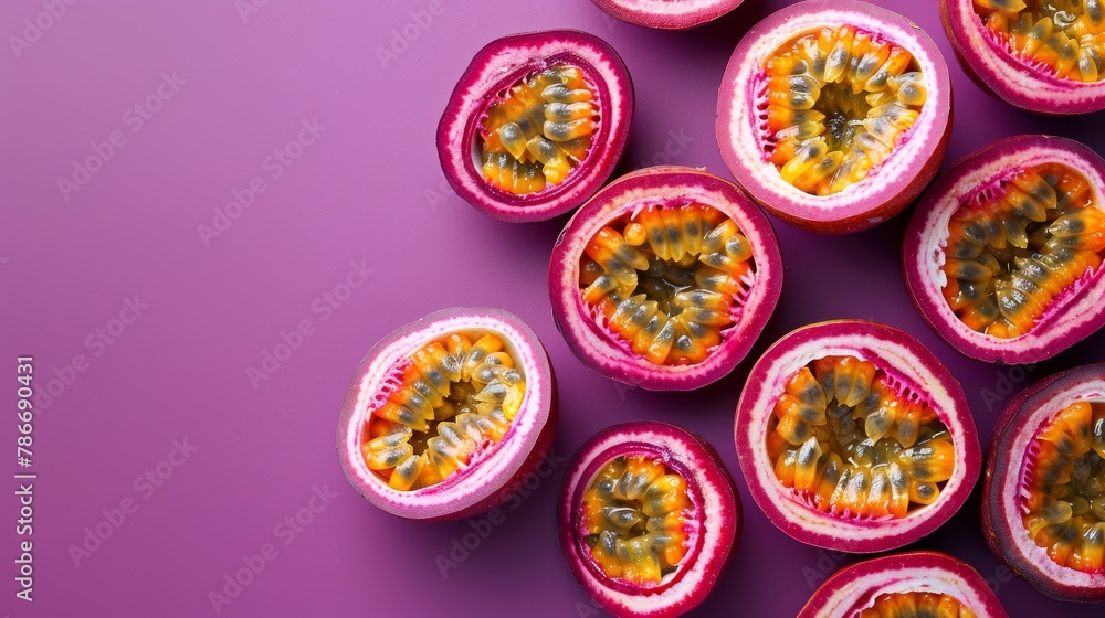 Ripe slices of passion fruit spread out on a vibrant purple background, emphasizing the seedy center, with space for text at the top Ripe slices of passion fruit spread out on a vibrant purple background, emphasizing the seedy center, with space for text at the top
