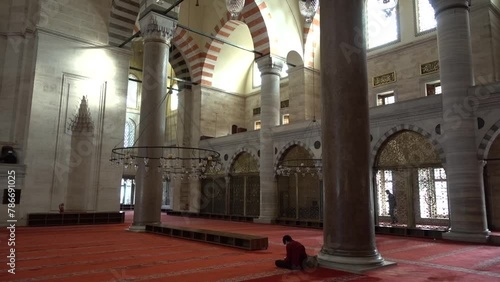 Istanbul, a believer in prayer in Sultan Suleiman's mosque photo