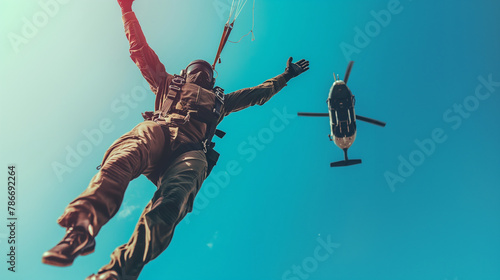 Parachutist jumping out of a helicopter into clear blue skies. Happiness, love, health, courage, desire to live
