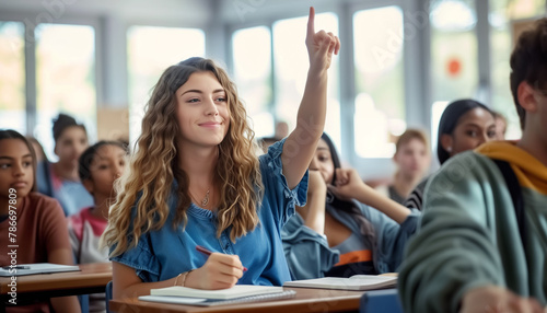 confident teenage girl raises hand in classroom full of students. She looks engaged, eager to participate in discussion. Diverse group of students in background adds to educational atmosphere of scene © Soloviova Liudmyla
