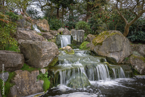 Waterfall in Kyoto Garden, a Japanese garden in Holland Park, London, UK. Holland Park is a public park with woods and gardens in the London borough of Kensington.