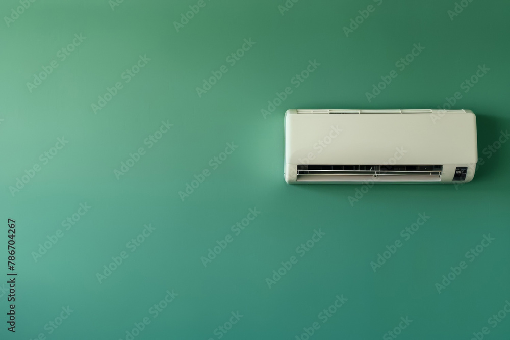 A white air conditioner is mounted on wall. Summer heat concept A white air conditioner is mounted on wall. Summer heat concept