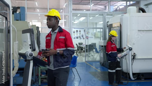 Group of multiethnic engineer researching and developing a robotics arm in scientific technology laboratory. Technician examining Industrial robot machine. Automated and manufacturing factory concepts