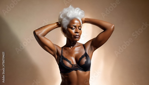 Portrait of a mature african american woman in lingerie. Senior black female model posing in underwear. Copy space