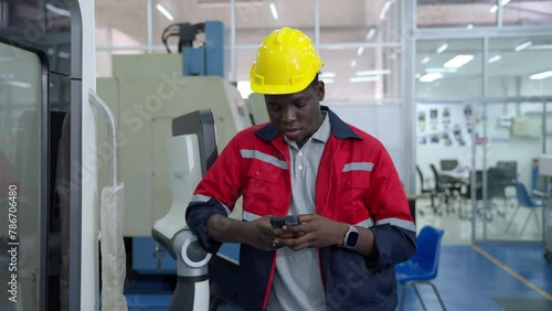 Group of multiethnic engineer researching and developing a robotics arm in scientific technology laboratory. Technician examining Industrial robot machine. Automated and manufacturing factory concepts