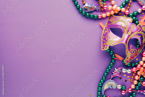 Mardi Gras carnival mask and beads on purple background photo