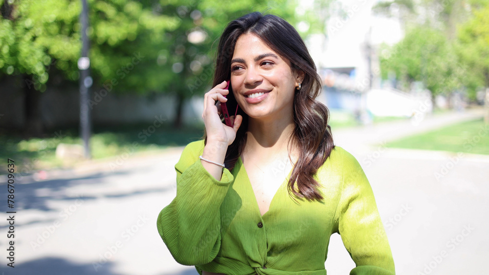 Beautiful Latin woman talking on mobile phone Beautiful Latin woman talking on mobile phone
