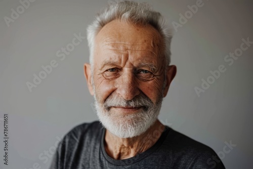Portrait of an old man with grey hair and a beard.