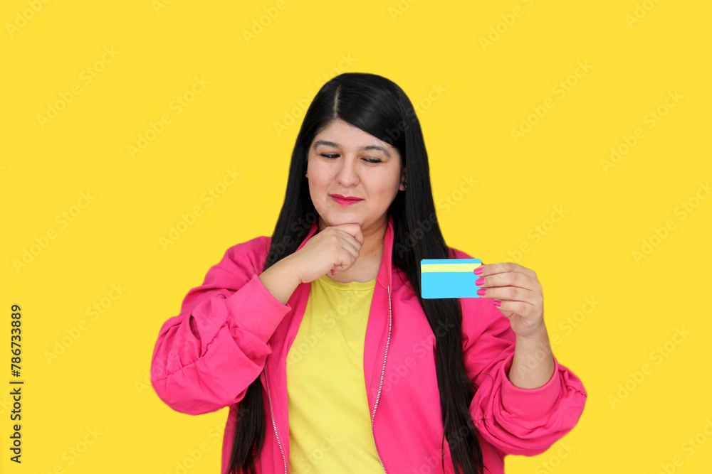 30-year-old Latina woman shows the credit card she uses for purchases, excited and amazed at promotions, discounts and monthly payments 30-year-old Latina woman shows the credit card she uses for purchases, excited and amazed at promotions, discounts and monthly payments