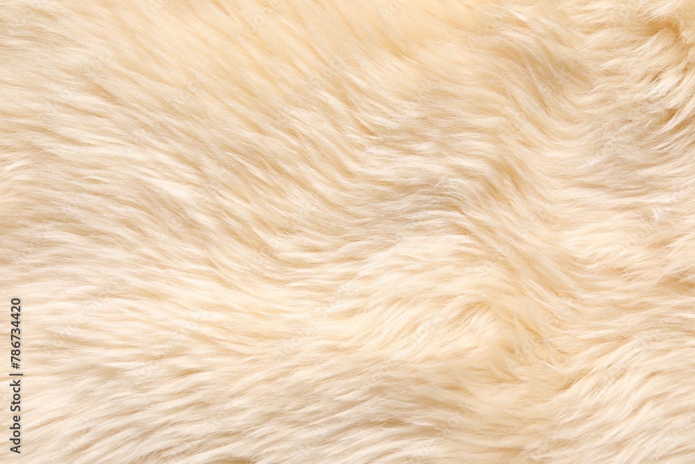 Texture of beige faux fur as background, top view Texture of beige faux fur as background, top view