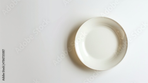 White empty plate on white background, top view