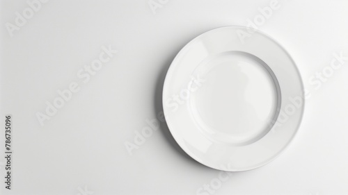 Simple white round plate on background