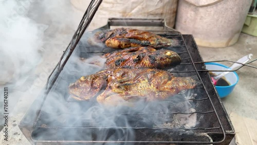closeup of grilled fish on the charcoal grill, grilled fish on the barbecue
