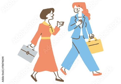 Two businesswomen walking while talking_Color