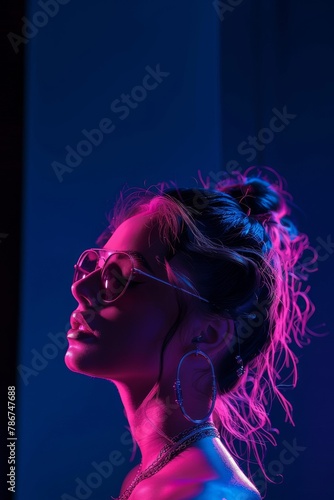 Young woman is facing away from the camera, highlighted by vibrant neon lights that cast dramatic shadows and accentuate her profile