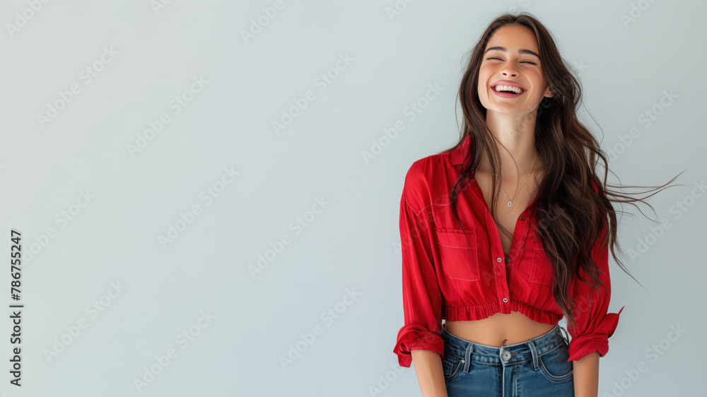 Brunette woman wearing red shirt smiling laugh out loud isolated on grey Brunette woman wearing red shirt smiling laugh out loud isolated on grey