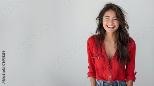 Hispanic woman wearing red shirt smiling laugh out loud isolated on grey
