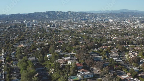 Aerial pullback shot of Beverly Hills suburban area in Los Angeles California