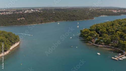 Drone aerial view of Mediterranean sea view with boats in a bay photo