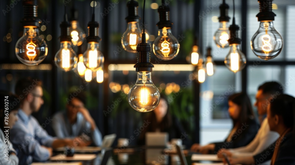 A roundtable discussion under a canopy of hanging lightbulbs, with one bulb shining brightest as a team member articulates their idea, highlighting the moment of insight and collective enthusiasm. A roundtable discussion under a canopy of hanging lightbulbs, with one bulb shining brightest as a team member articulates their idea, highlighting the moment of insight and collective enthusiasm.