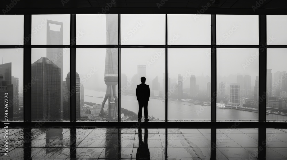 A solitary businessman standing before a large window overlooking the city skyline, his silhouette reflecting a moment of contemplation amidst the chaos of corporate life.
