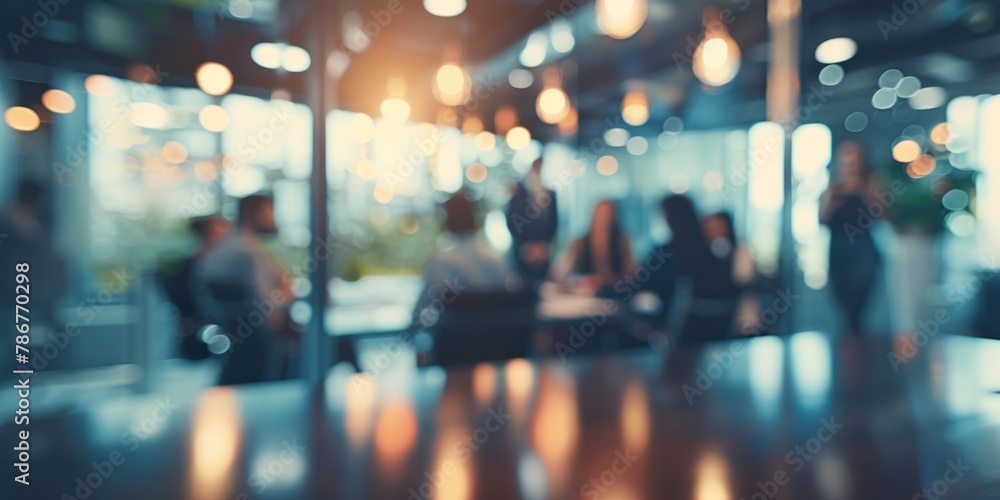 A business team collaborates in an office meeting room, with a blurred background and bokeh effect creating depth of field.