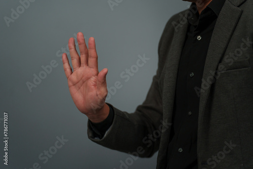 businessman in suit showing five fingers or fingerprint scan touching